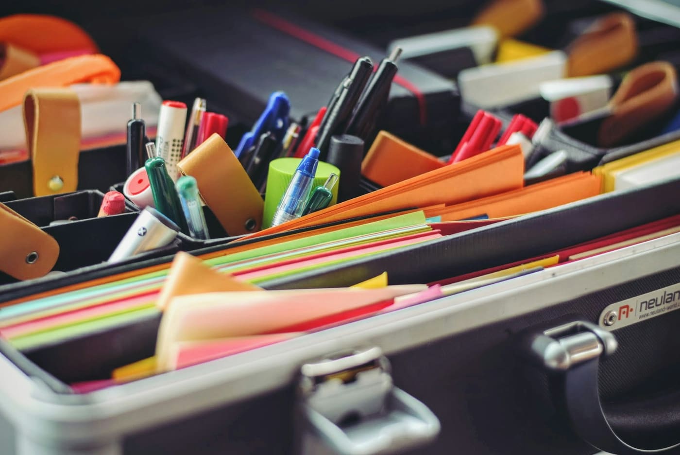 Stationery and branded goods laid out on a desk